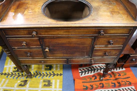 A Regency mahogany washstand with cistern compartment and basin recess W.94cm.